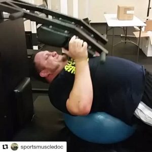 Samoa Joe trying out the unique machines at Revolution PT w/Dr. Lyneil Mitchell 